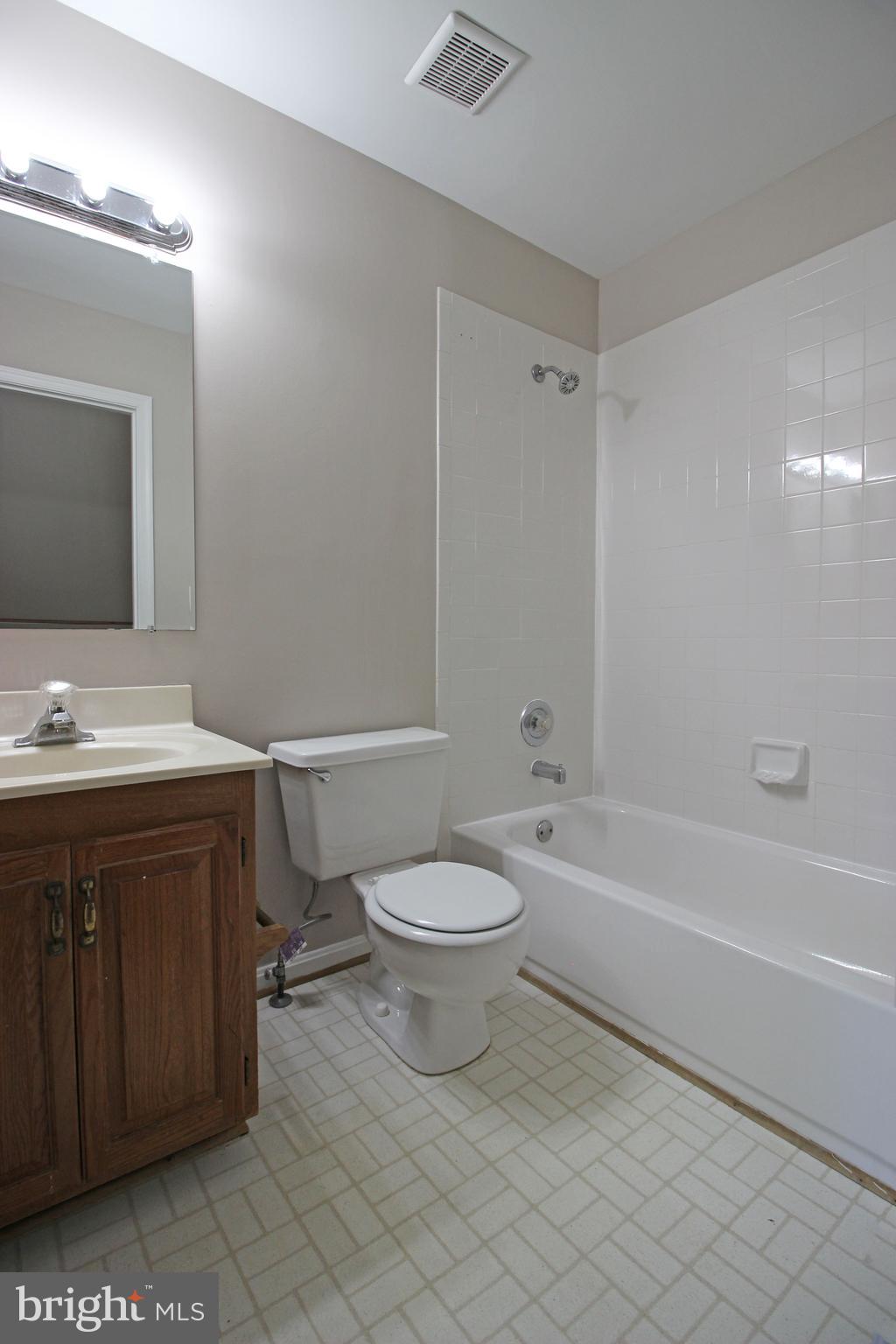 7609 Monitor Court Manassas, VA 20109 - Photo 32 of 32 a bathroom with a sink a toilet and shower