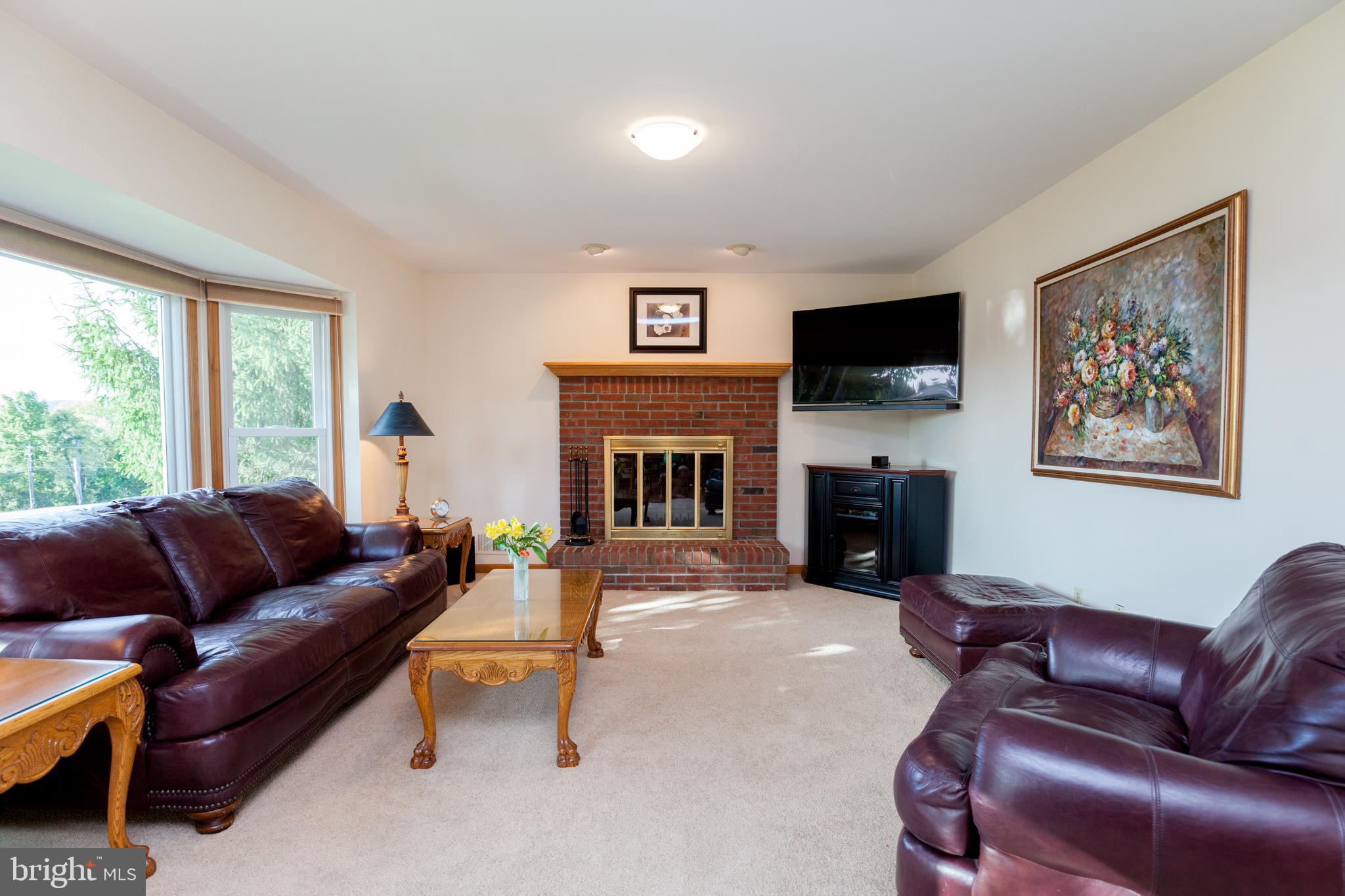30 Farmhouse Road Milford, NJ 08848 - Photo 13 of 41 Family Room w/ Bay Windows & Brick Fire Place