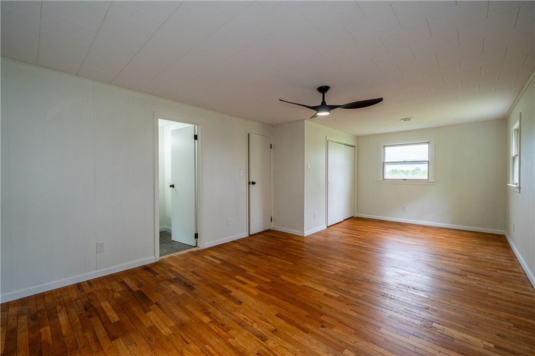 11296 Pansing Road Brookville, OH 45309 - Photo 19 of 53 This light-filled room features pristine hardwood floors and a modern ceiling fan for ultimate comfort.