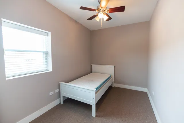 a room with a bed and a window