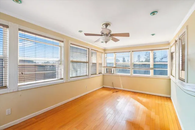 an aerial view of multiple houses with yard