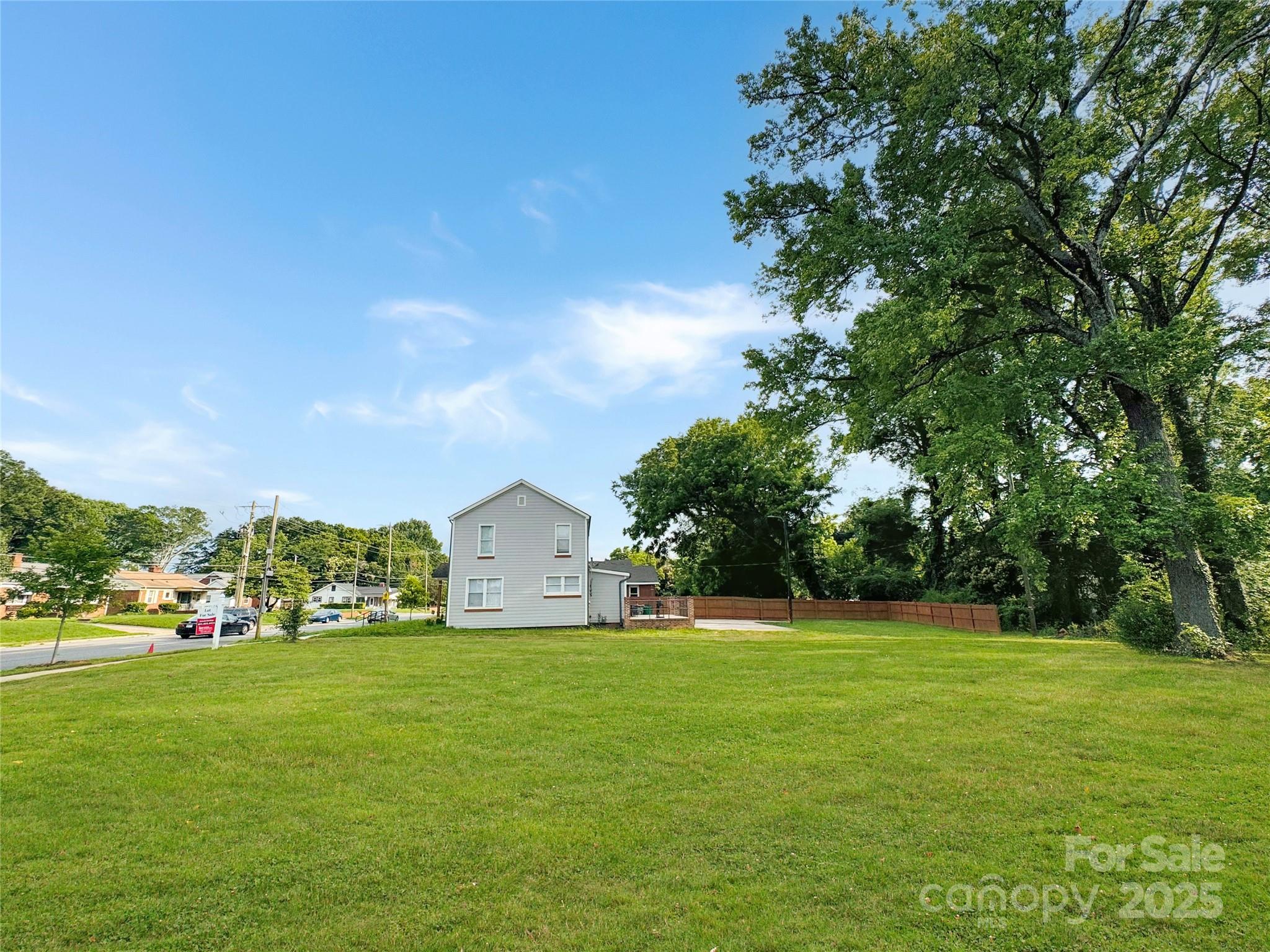1717 Beatties Ford Road Charlotte, NC 28216 - Photo 3 of 6 a view of green field with tree in the background