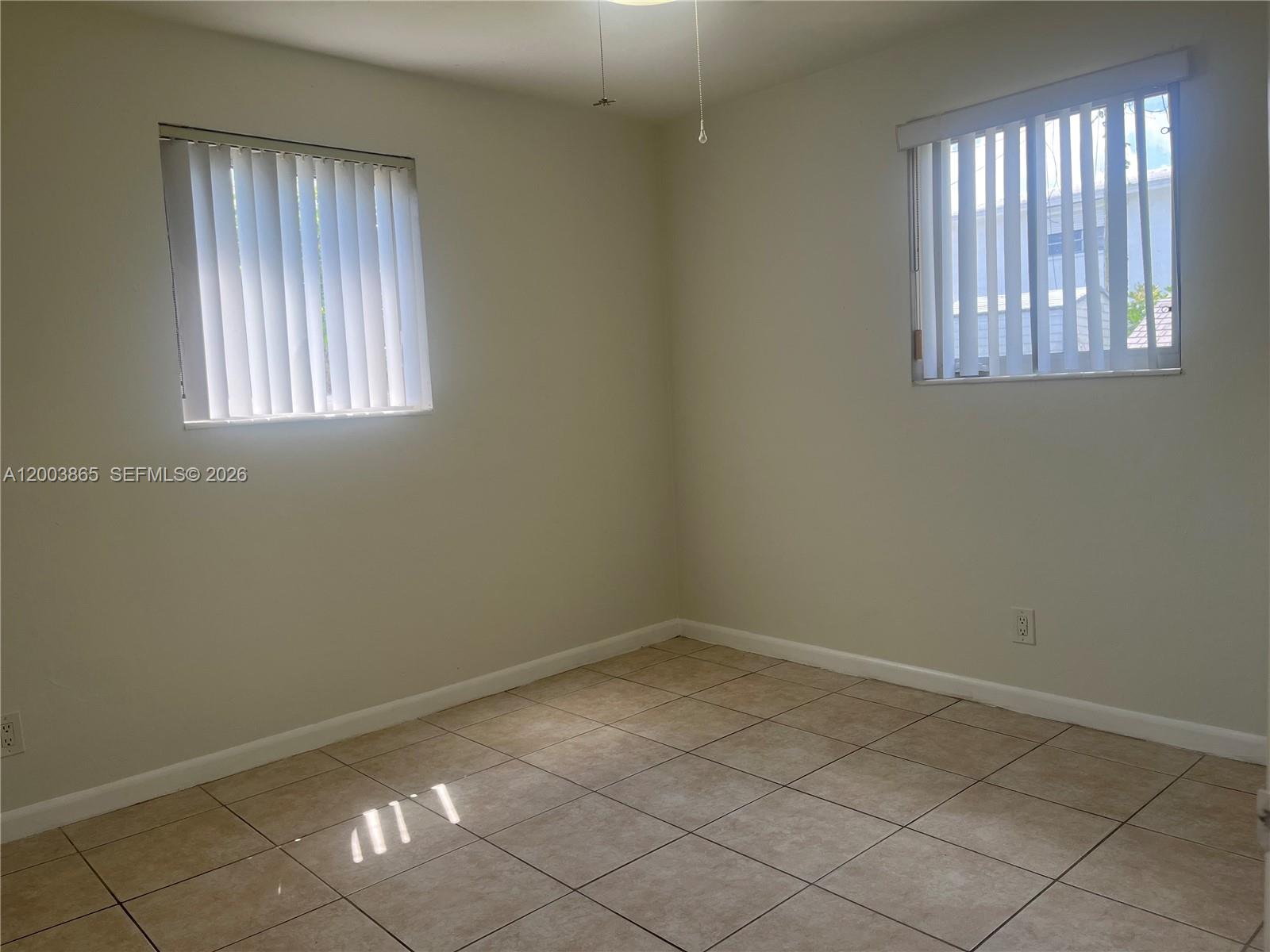 753 Southwest 3rd Street Dania Beach, FL 33004 - Photo 14 of 16 an empty room with windows