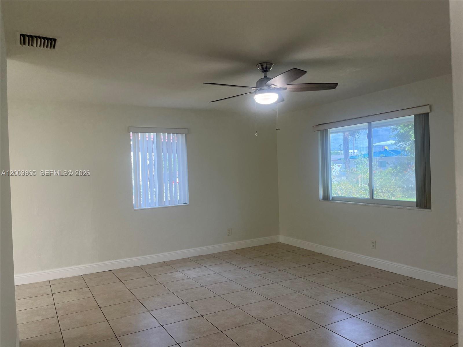753 Southwest 3rd Street Dania Beach, FL 33004 - Photo 4 of 16 a view of an empty room with a window