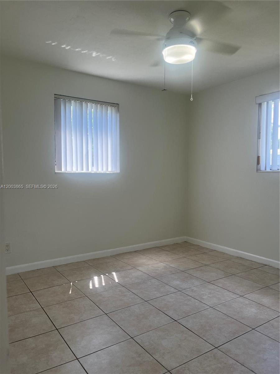 753 Southwest 3rd Street Dania Beach, FL 33004 - Photo 8 of 16 a view of an empty room with a window