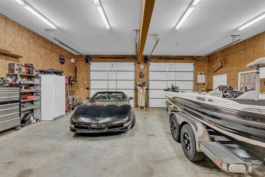 465 Hickory Lane Sparta, TN 38583 - Photo 19 of 46 a car and bike in a garage