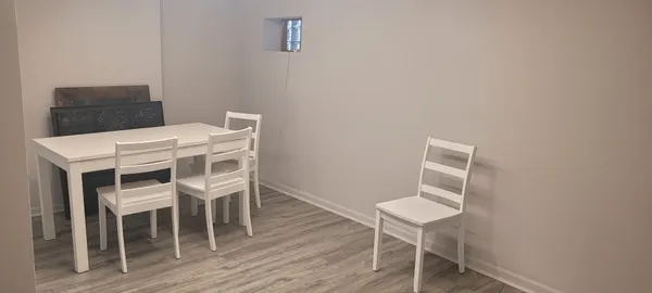 a workspace with furniture and wooden floor