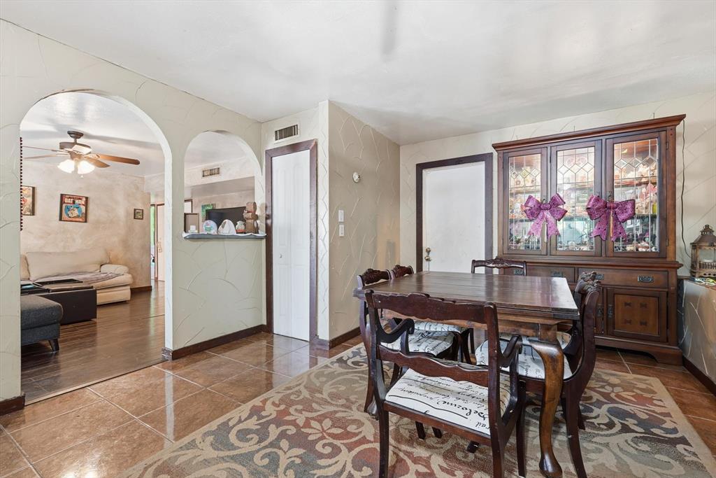 6317 Locust Street Rowlett, TX 75089 - Photo 11 of 34 Tiled dining area featuring a ceiling fan and baseboards