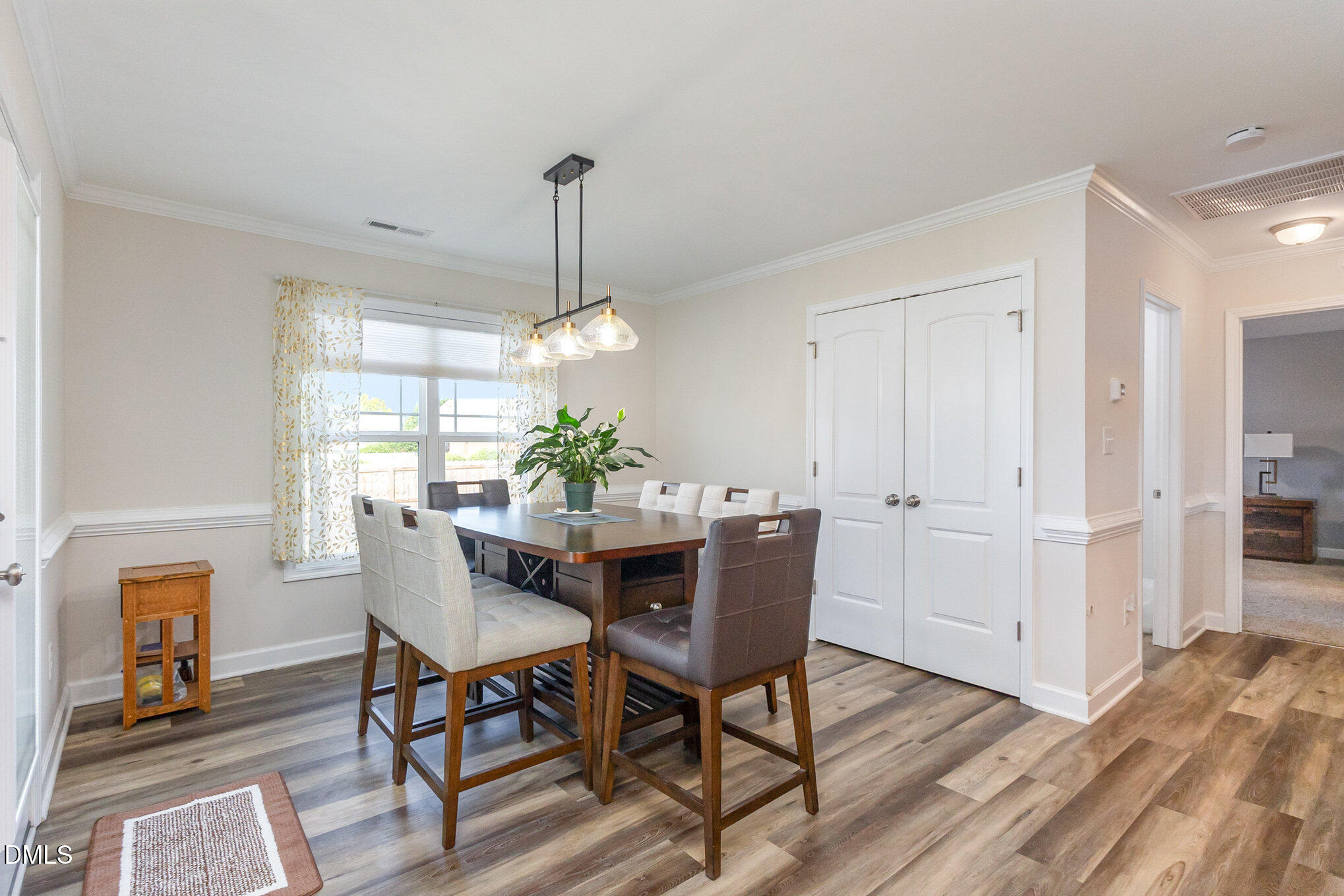 146 Wheat Drive Angier, NC 27501 - Photo 11 of 46 a view of a dining room with furniture window and wooden floor