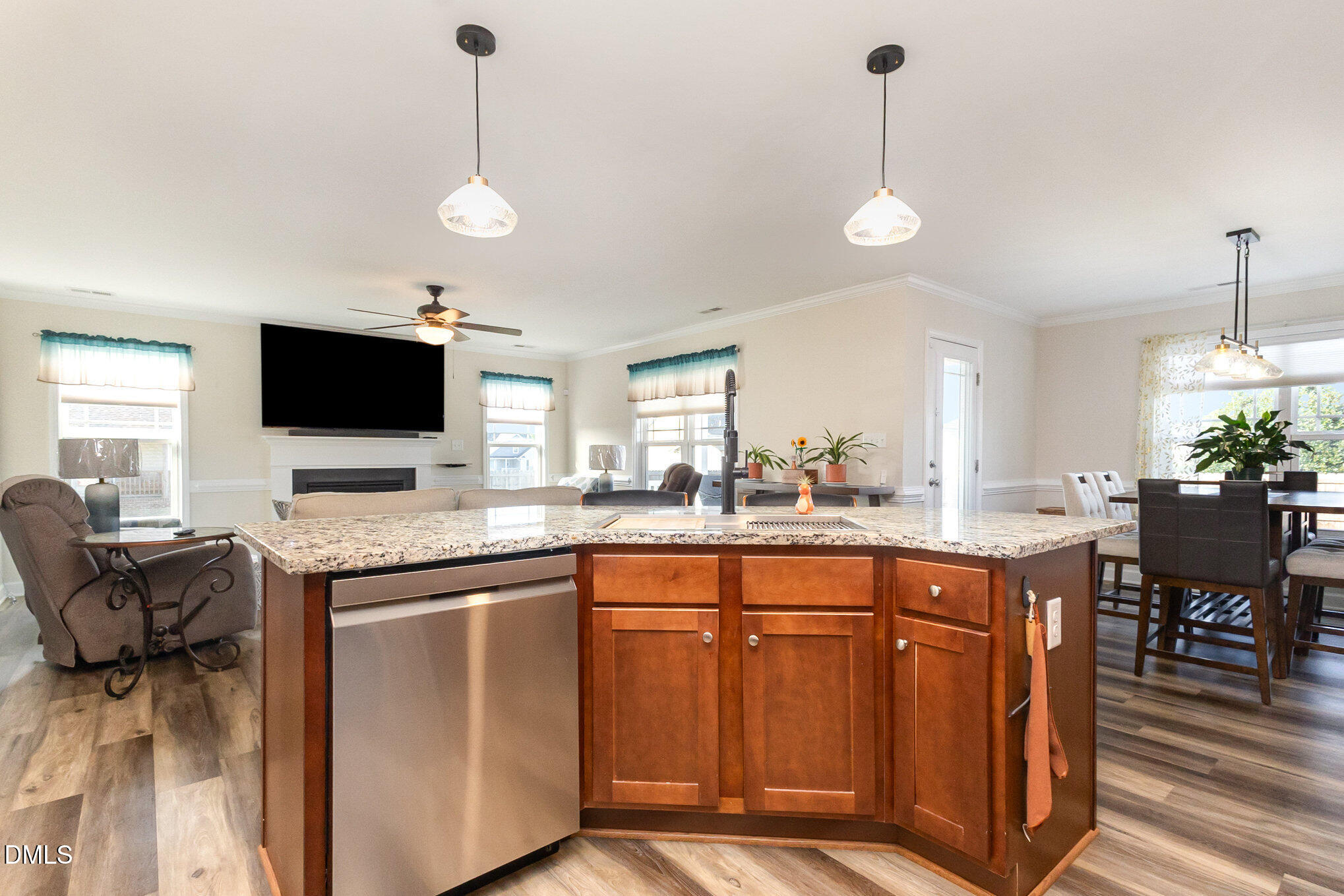 146 Wheat Drive Angier, NC 27501 - Photo 14 of 46 a kitchen with stainless steel appliances granite countertop a sink a stove and a wooden floors