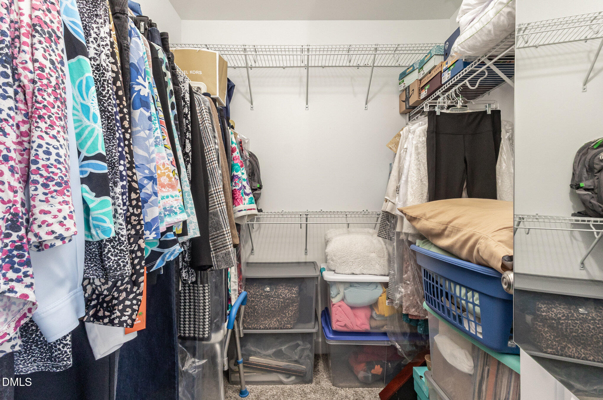 146 Wheat Drive Angier, NC 27501 - Photo 20 of 46 a view of walk in closet with clothes and shoes