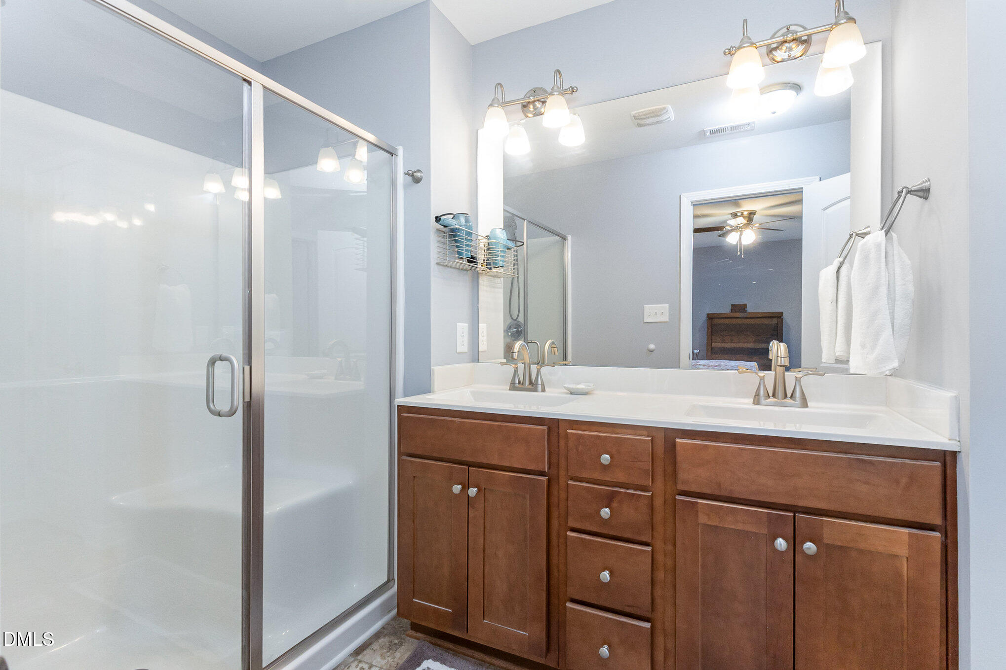 146 Wheat Drive Angier, NC 27501 - Photo 21 of 46 a bathroom with a double vanity sink mirror and double