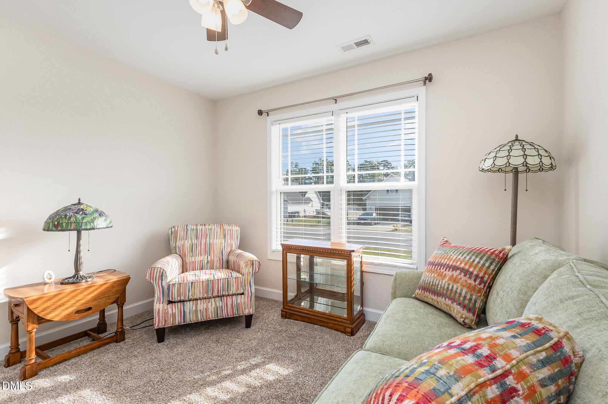 146 Wheat Drive Angier, NC 27501 - Photo 24 of 46 a bedroom with a bed and a couch