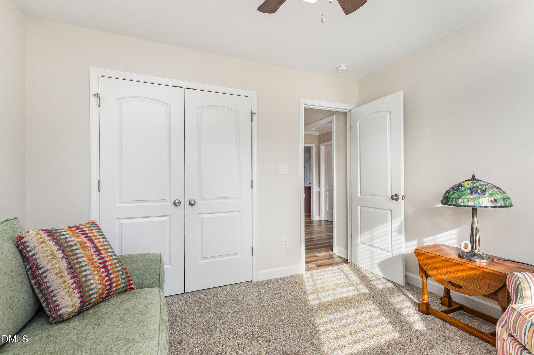 146 Wheat Drive Angier, NC 27501 - Photo 25 of 46 a bedroom with a bed and a chandelier