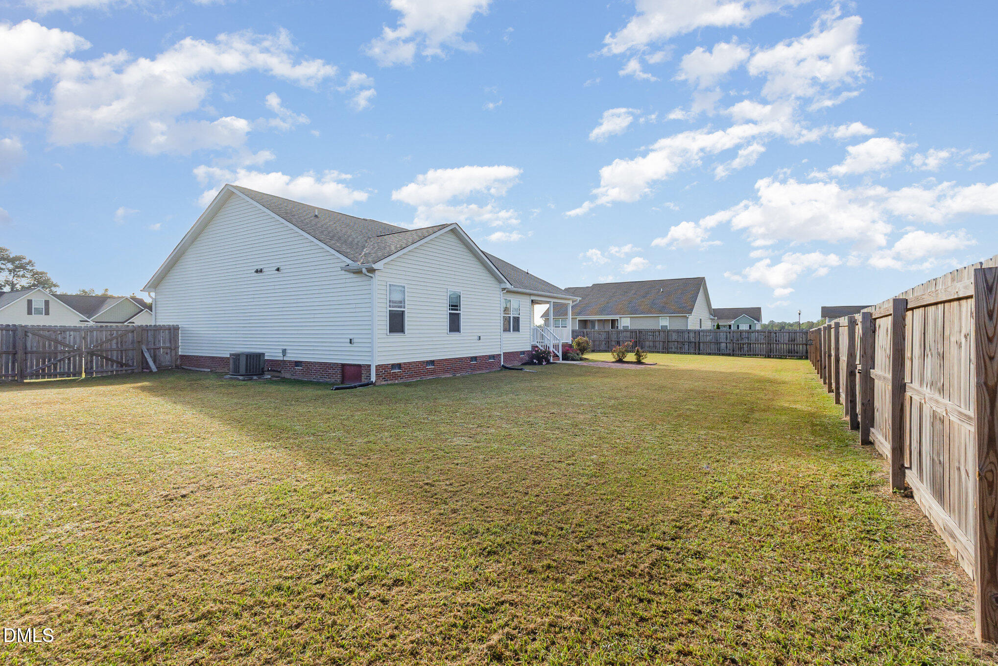 146 Wheat Drive Angier, NC 27501 - Photo 36 of 46 a view of a swimming pool with an outdoor space and seating area