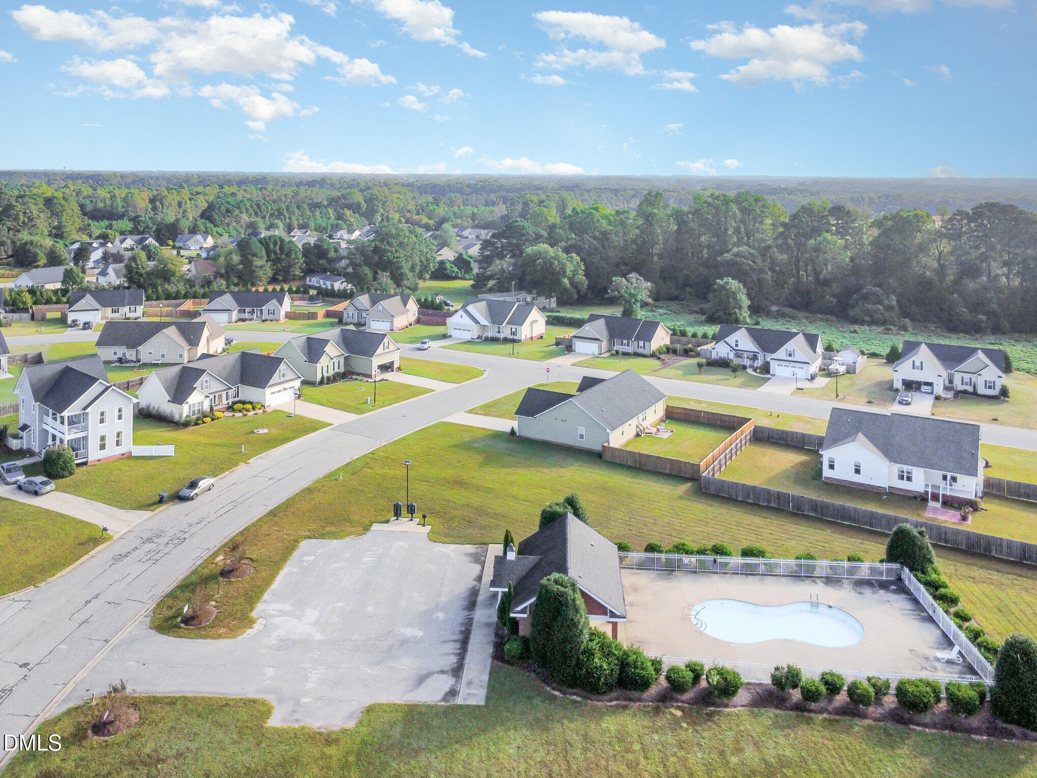 146 Wheat Drive Angier, NC 27501 - Photo 42 of 46 a view of a swimming pool with a lawn chairs