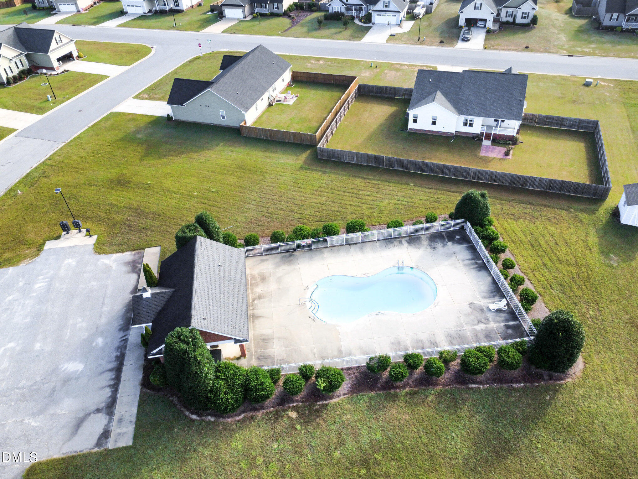 146 Wheat Drive Angier, NC 27501 - Photo 43 of 46 a view of a swimming pool with chairs