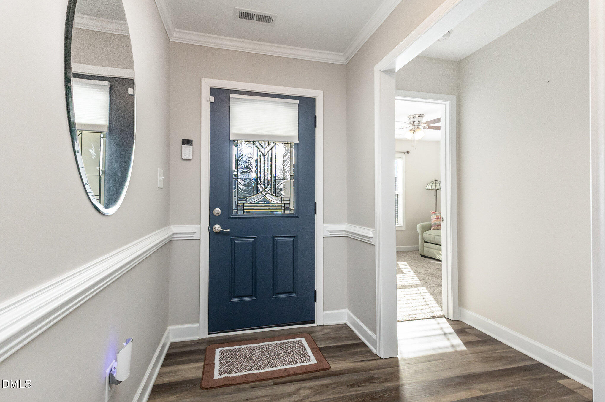146 Wheat Drive Angier, NC 27501 - Photo 5 of 46 a view of an entryway with wooden floor