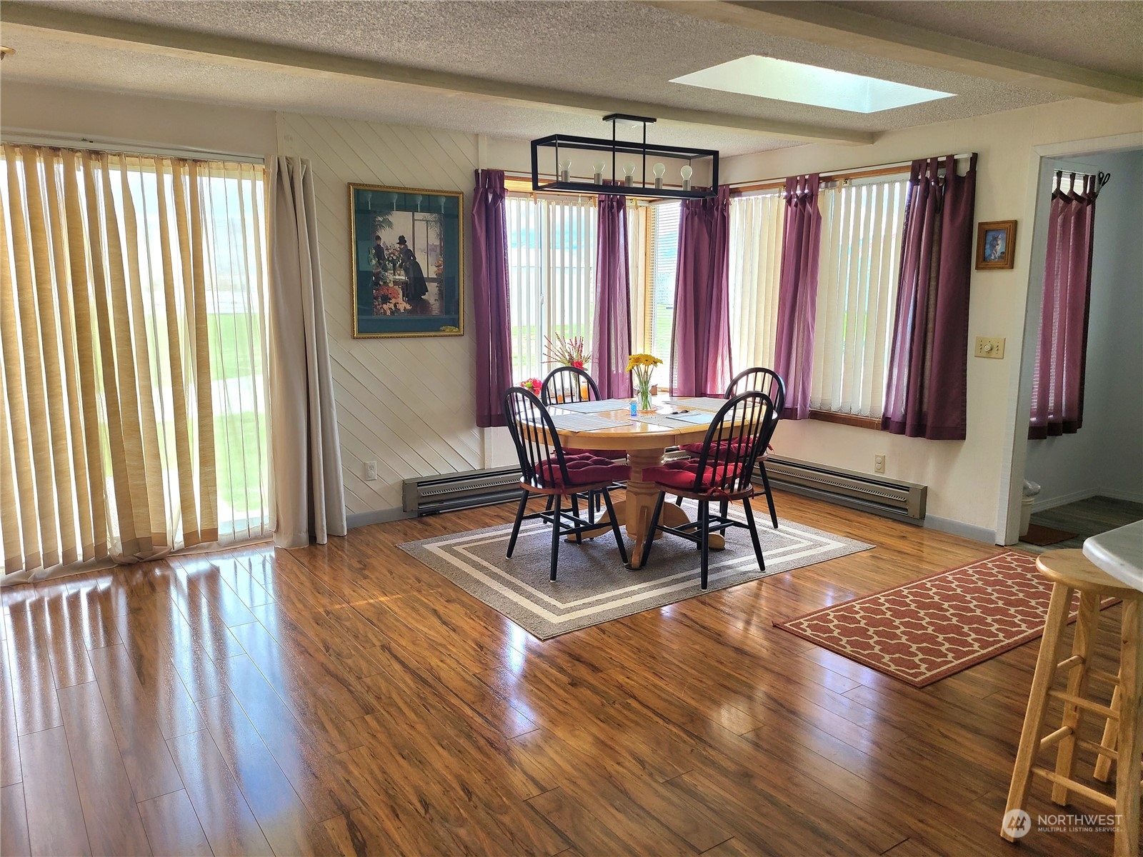 28 Robinson Canyon Road Omak, WA 98841 - Photo 19 of 33 a dining room with wooden floor table and chairs