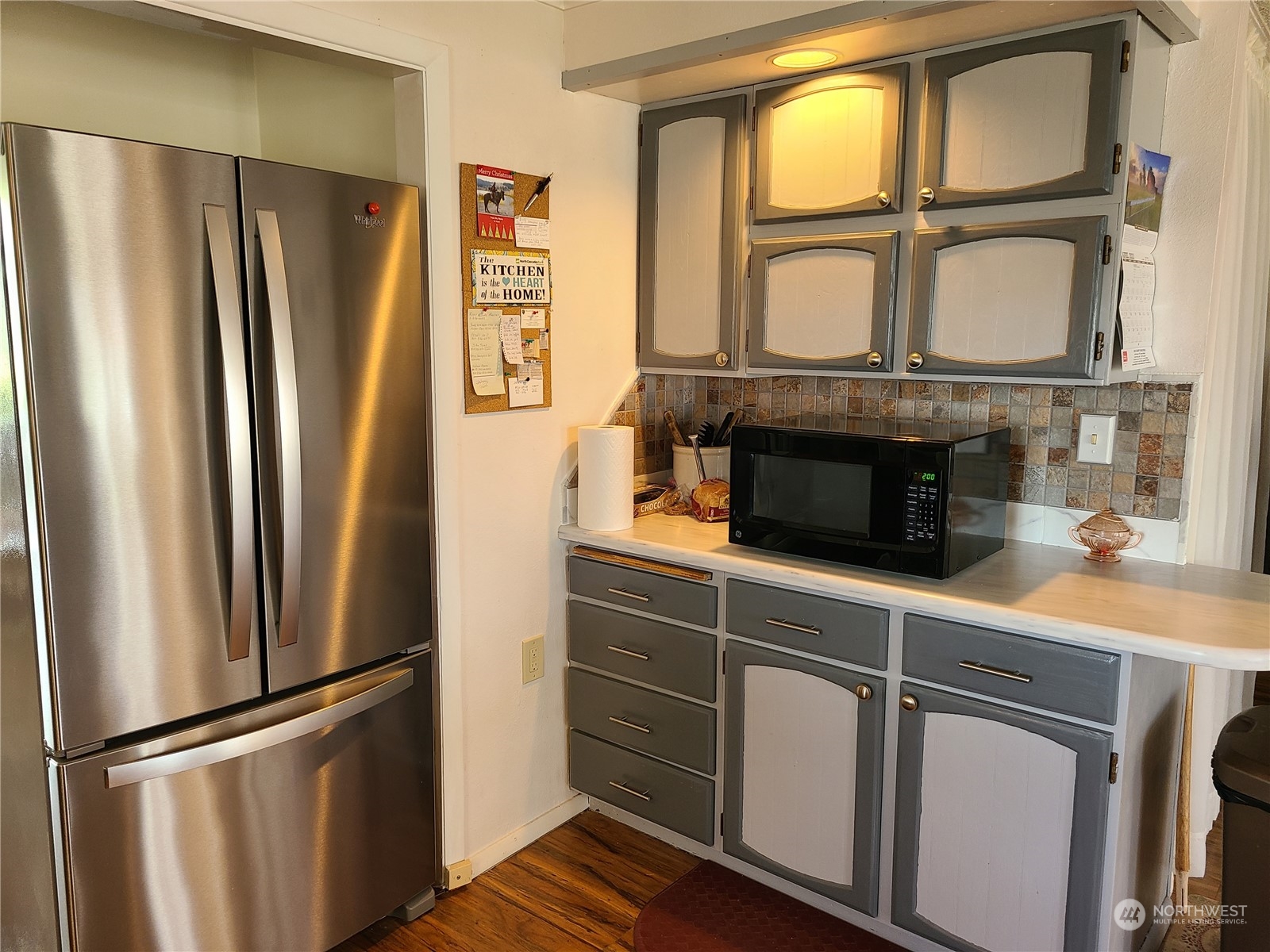 28 Robinson Canyon Road Omak, WA 98841 - Photo 22 of 33 a kitchen with stainless steel appliances a refrigerator and a window