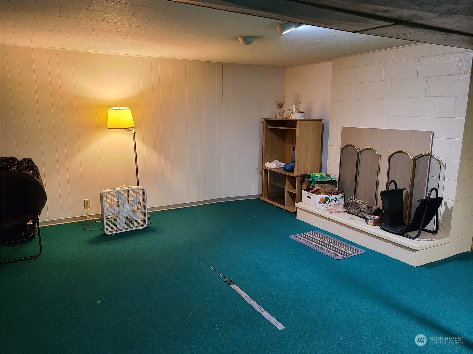 28 Robinson Canyon Road Omak, WA 98841 - Photo 31 of 33 a room with gym equipment and a fireplace