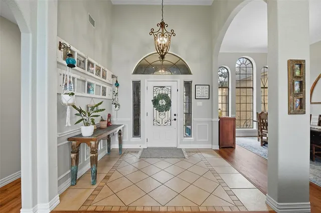 a view of a dining room with furniture and a window
