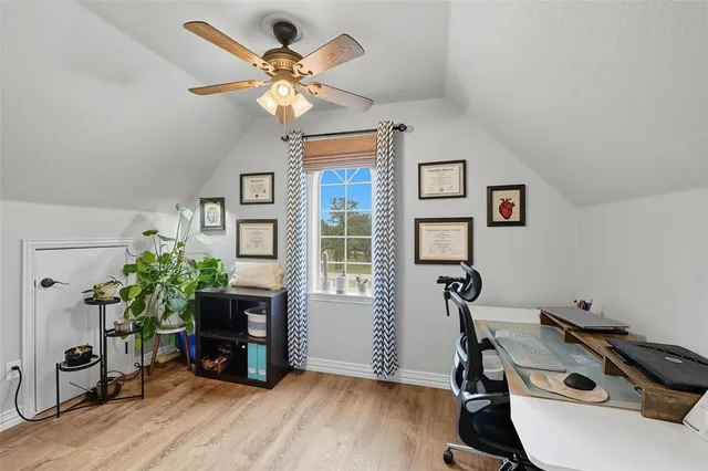 a workspace with furniture and a window