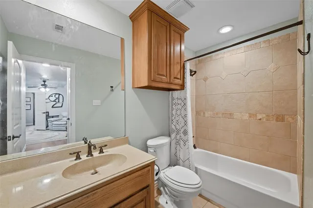 a view of a workspace with furniture and a wooden floor