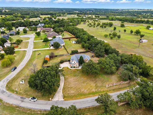 a view of a house with a yard and garage
