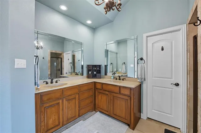 a view of a hallway with windows and cabinet