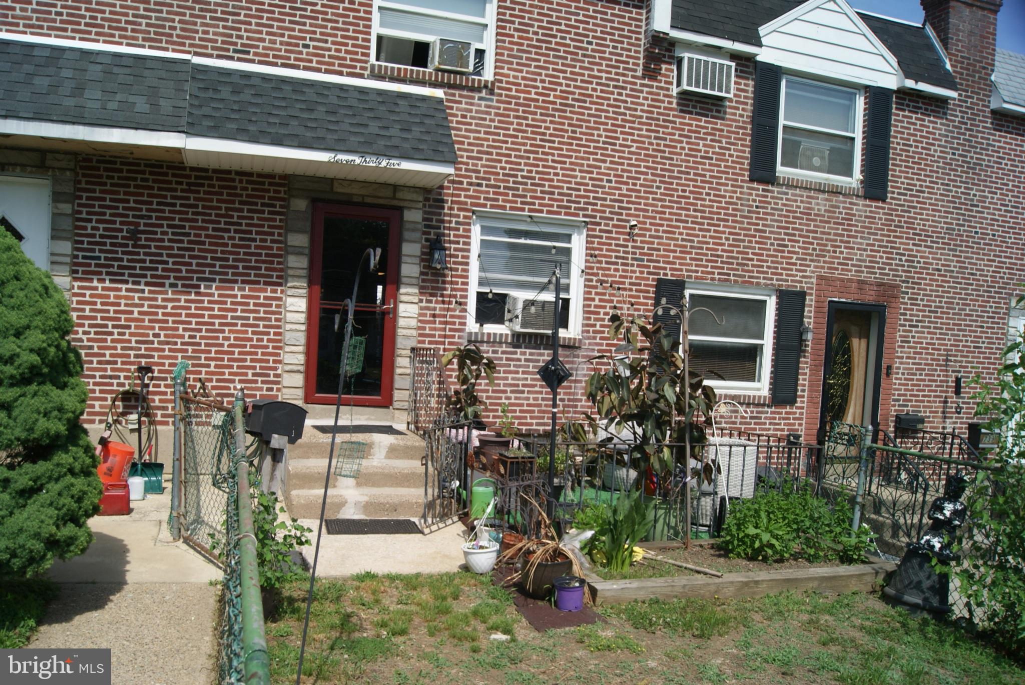 735 Grant Road Folcroft, PA 19032 - Photo 6 of 57 Charming brick facade with lush greenery.