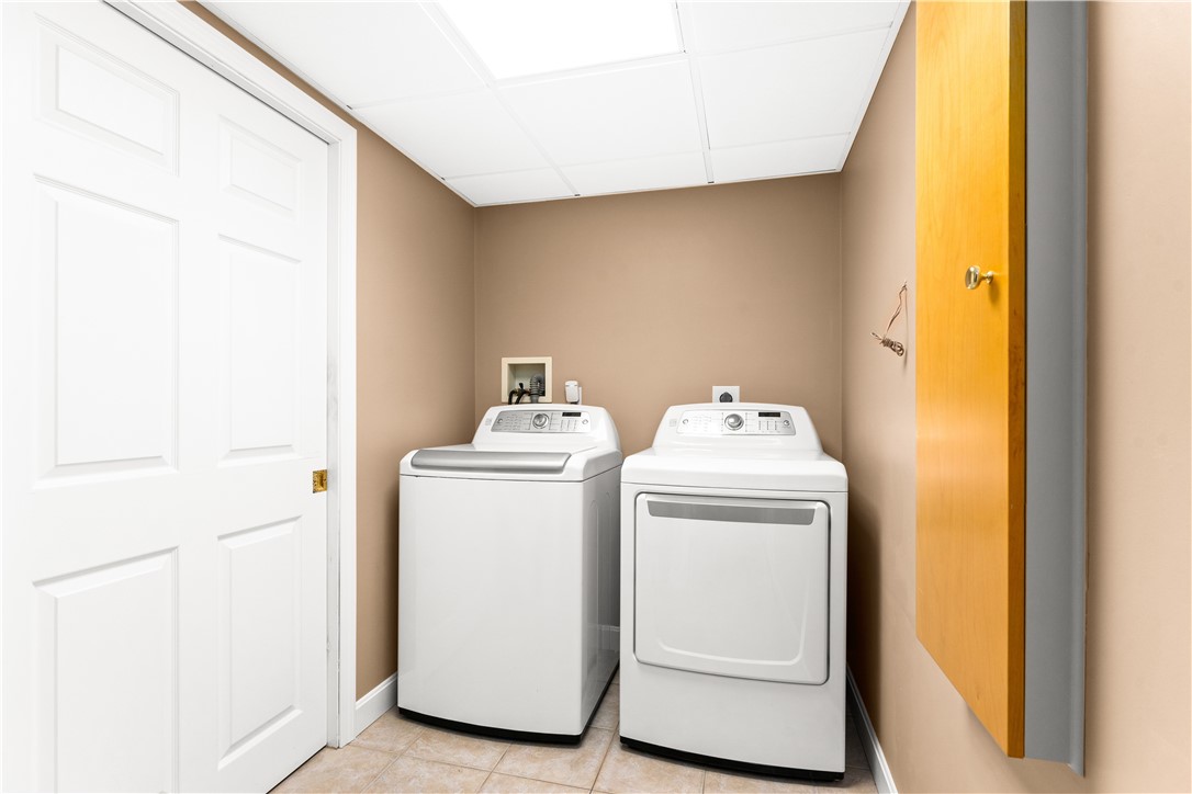 245 Hardig Road Warwick, RI 02886 - Photo 28 of 32 Laundry room with closet and built in ironing board.