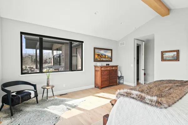 a bedroom with a bed and a desk