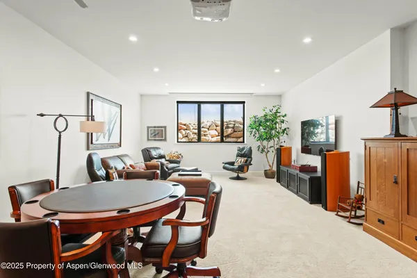 a dining room with furniture and window