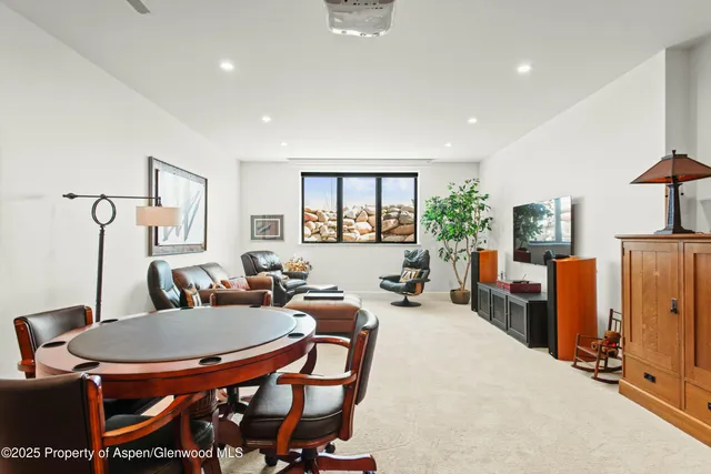 a dining room with furniture and window