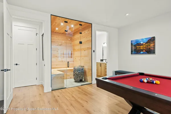 a bedroom with a bed and a table with mirror