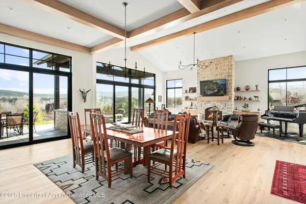 a view of a dining room with furniture window and outside view