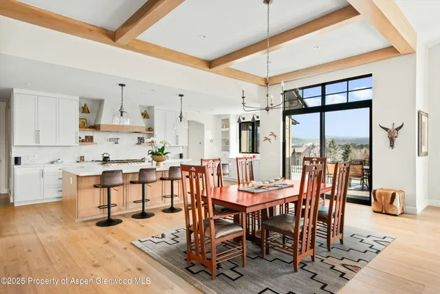 a view of a dining room with furniture and a table