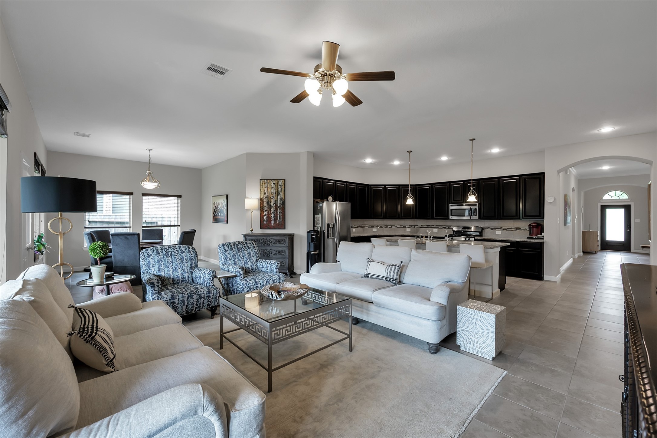 31507 Reston Cliff Court Spring, TX 77386 - Photo 11 of 31 a living room with furniture and kitchen view