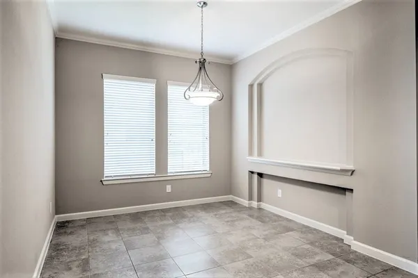 a spacious bedroom with a bed and a couch
