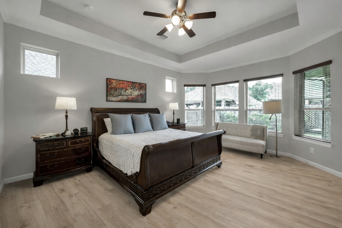 31507 Reston Cliff Court Spring, TX 77386 - Photo 14 of 30 a spacious bedroom with a bed and a couch