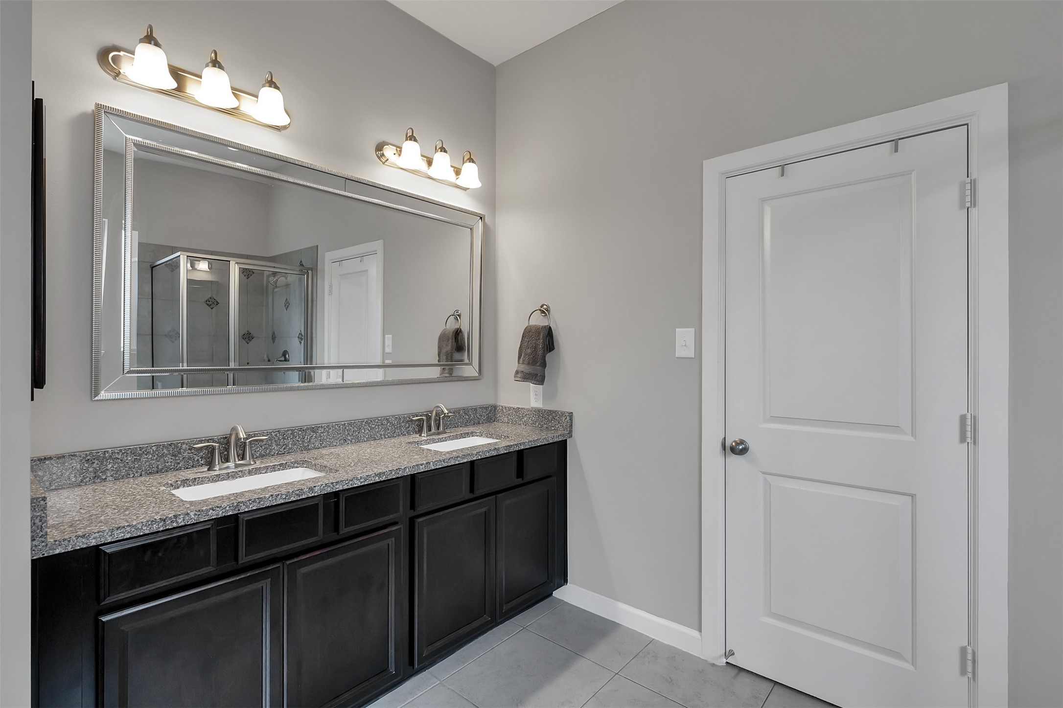 31507 Reston Cliff Court Spring, TX 77386 - Photo 15 of 31 a bathroom with a double vanity sink and a mirror