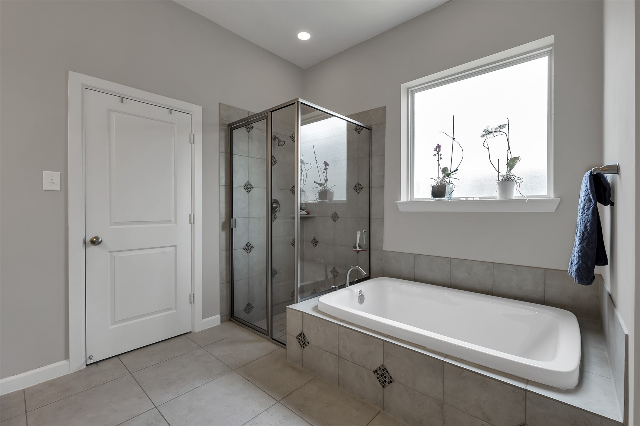 31507 Reston Cliff Court Spring, TX 77386 - Photo 16 of 31 a bathroom with a tub a window and a shower