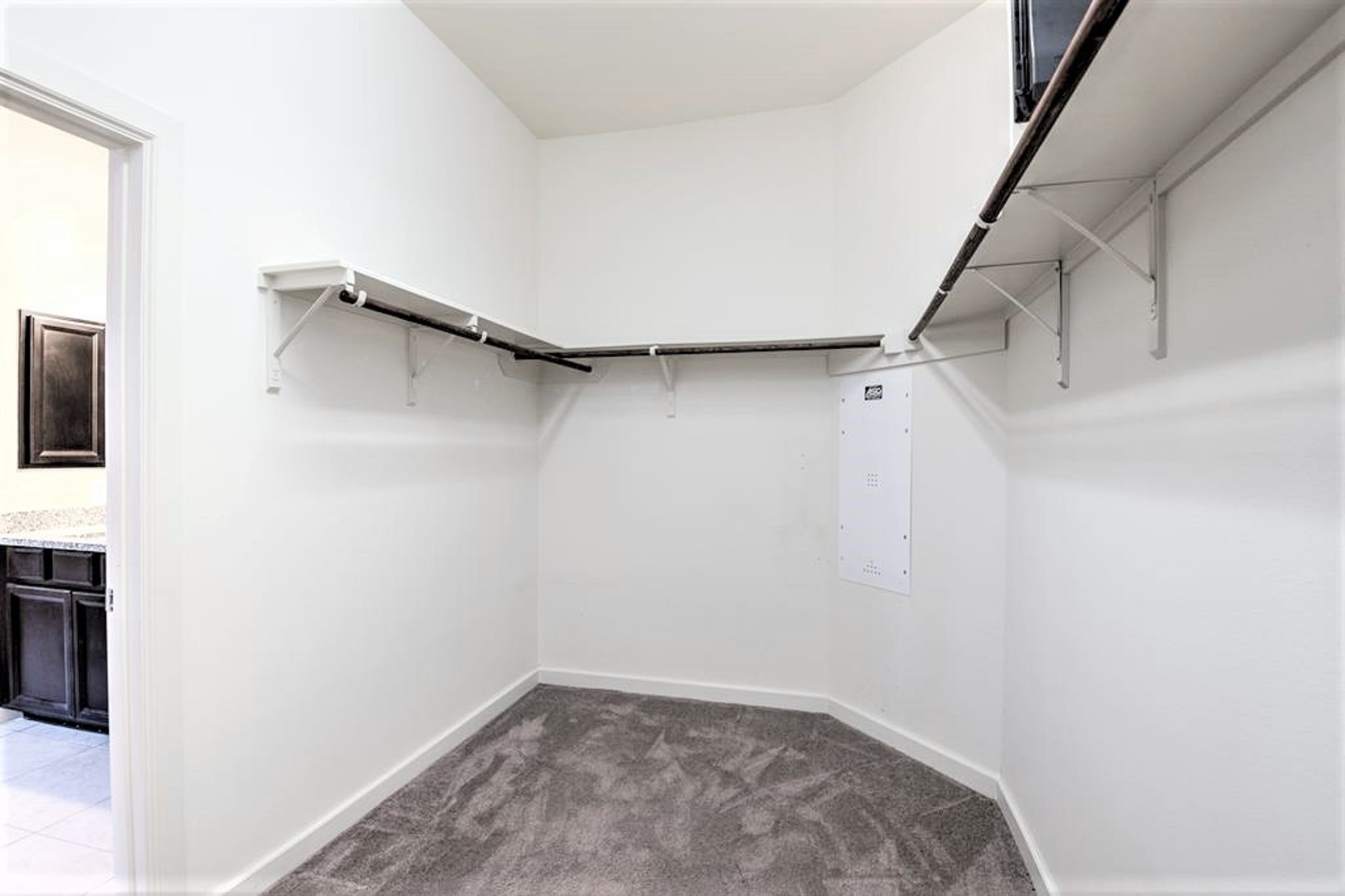 31507 Reston Cliff Court Spring, TX 77386 - Photo 17 of 31 a view of walk in closet with empty racks