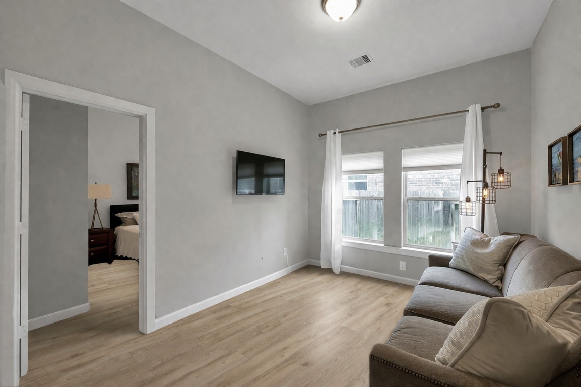 31507 Reston Cliff Court Spring, TX 77386 - Photo 18 of 30 a living room with furniture and a large window