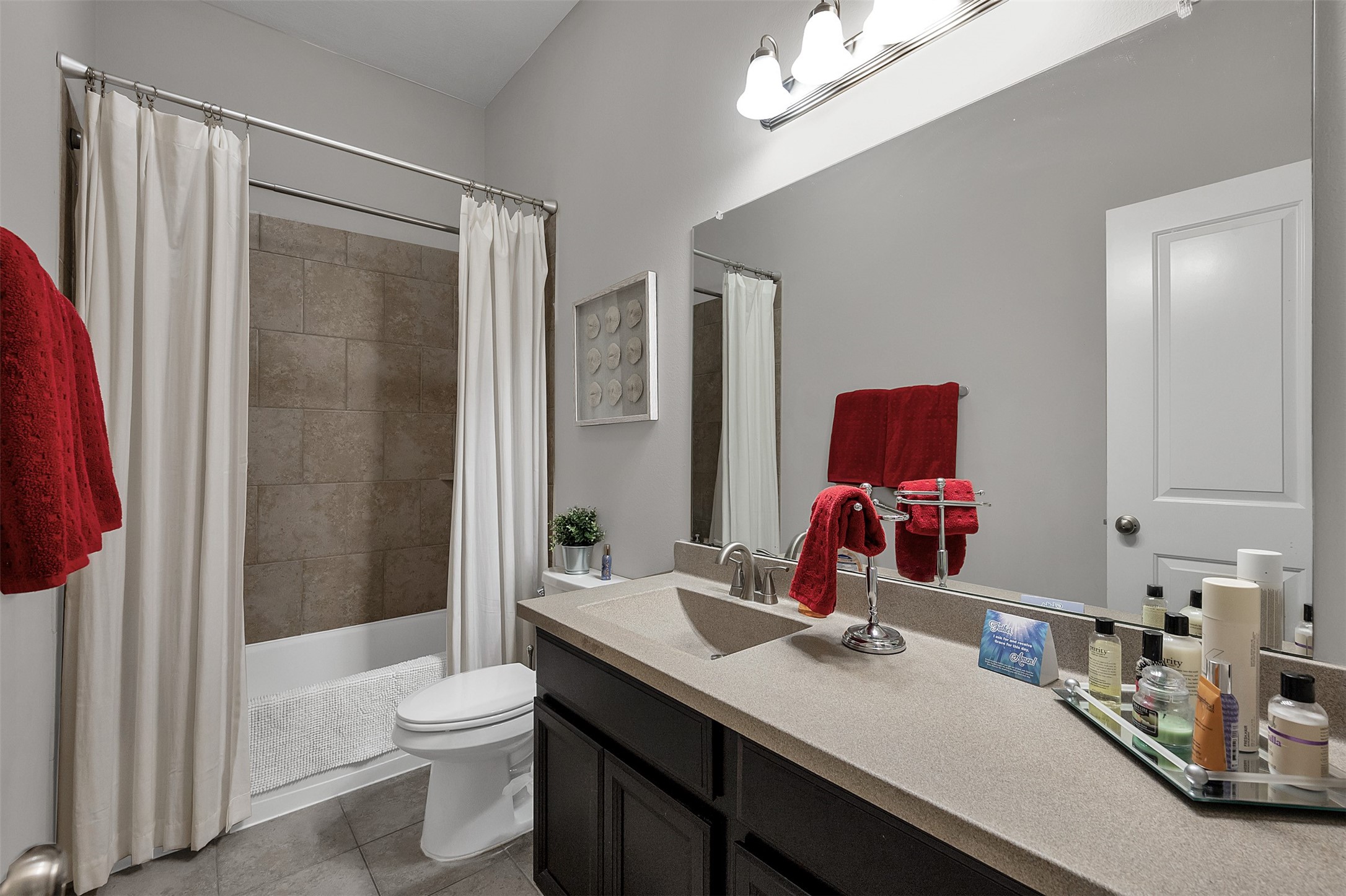 31507 Reston Cliff Court Spring, TX 77386 - Photo 20 of 31 a bathroom with a sink vanity mirror and toilet