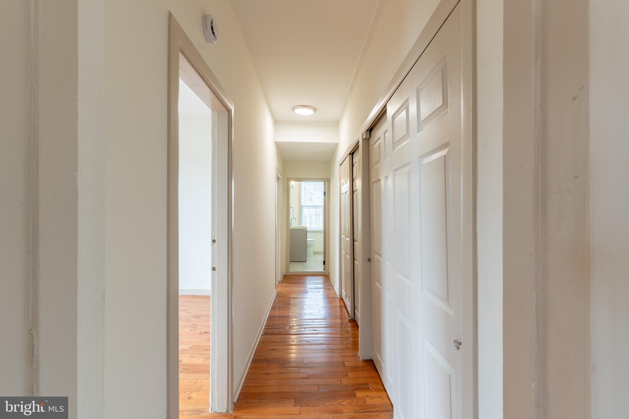 100 Potter Street, Unit 4 Haddonfield, NJ 08033 - Photo 11 of 17 a view of a hallway with wooden floor and a glass door