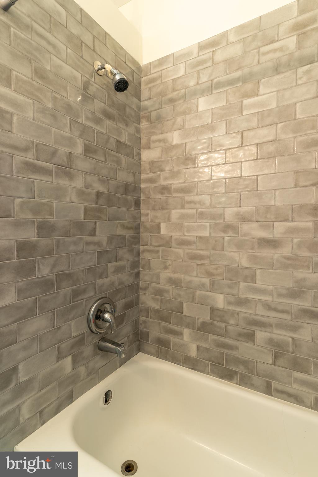 100 Potter Street, Unit 4 Haddonfield, NJ 08033 - Photo 15 of 17 a bathroom with a bathtub