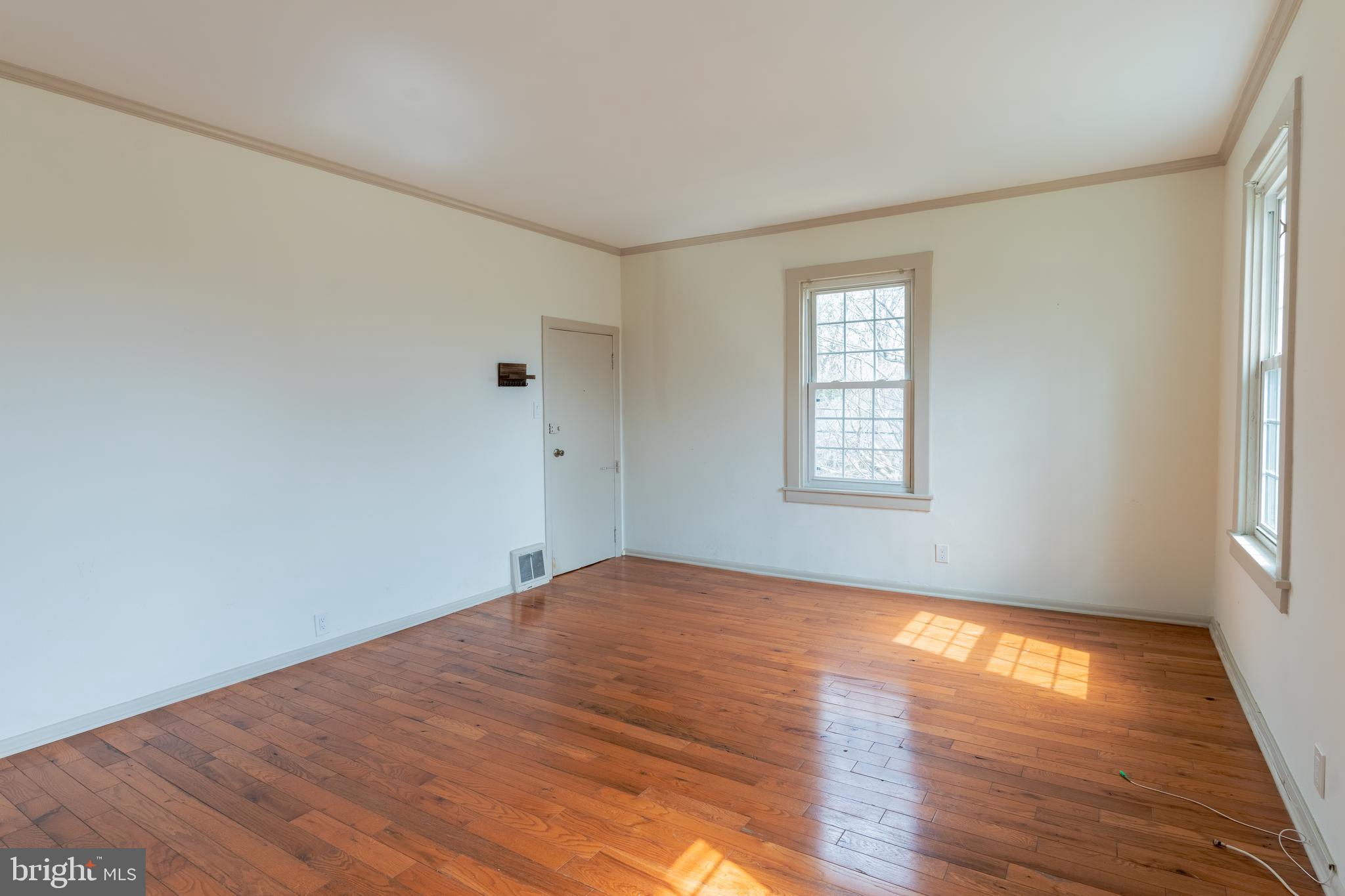 100 Potter Street, Unit 4 Haddonfield, NJ 08033 - Photo 9 of 17 a view of empty room with wooden floor and fan