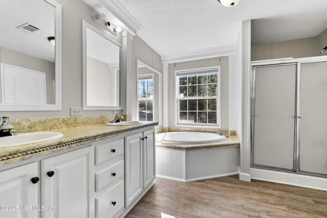 a bathroom with a granite countertop sink mirror and